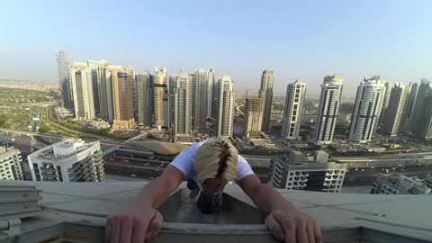 Man Performs Some High-Rise Stunts