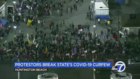 Crowds gather at Southern California beach to protest COVID-19 related curfew