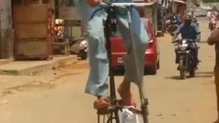 Funny One: Tallest Bicycle from India (May be in Word) - How he ride on it?