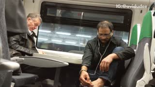 Man puts his feet on seat and picks at his toes on metro train
