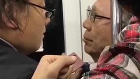 Two men glasses pushing each other on subway