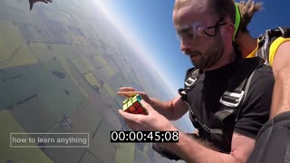 Skydiver Solves Rubik's Cube While Freefalling