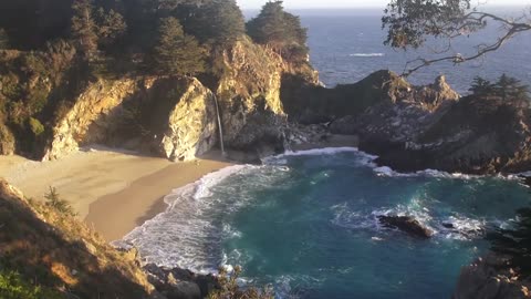 Relaxing Video of a Waterfall on an Ocean Beach at Sunset