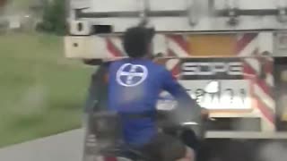 Motorcycle Man Bumper Jumping Cargo Truck