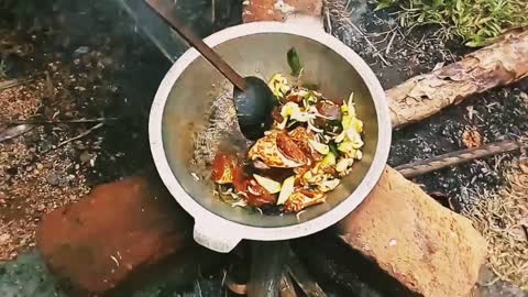 look how village people cook cooking in nature---raw fish cooking