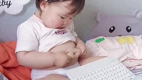 Cuttest baby making his tummy an adorable toy. Try not to laugh