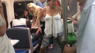 Older woman twerks on subway car