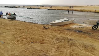 Small Boat Sailing In Magic Lake Of Wadi El Rayan Egypt