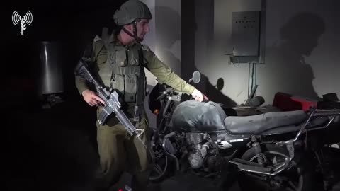 The IDF spokesman shows a motorcycle with gunshot wounds
