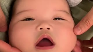 Baby Enjoys A Relaxing Face Massage