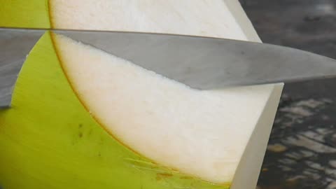 fantastic skill at slicing coconut