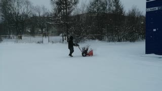 The man decided to clear the snow from the street.