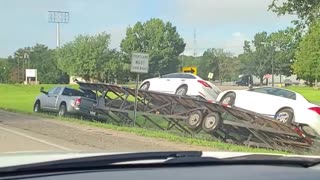 Truck Driver Takes Towed Cars on Grassy Detour