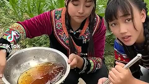 Two Cute woman make honey water