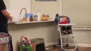 Baby has priceless reaction after dad throws cheese on his face
