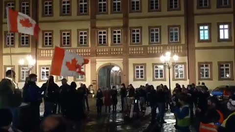 In Germany, people stood in silence and played the Canadian national anthem