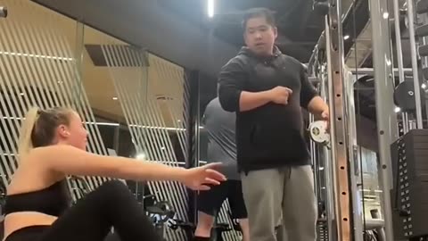This woman was too strong for seated face pulls, so a man came to help her...