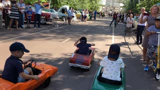 Kids Compete in Pedal Car Race