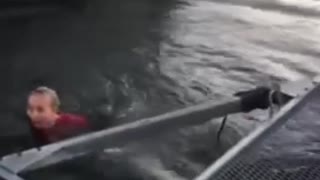 Two girls one guy on boat dock