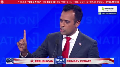 Vivek Ramaswamy Holds a Sign Saying, "Nikki = Corrupt" on the GOP Debate Stage