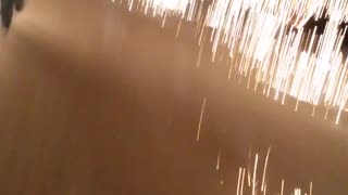 Guy lights firework and run away from it before it explodes
