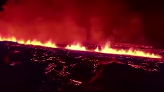 Aerial footage shows Iceland volcano spewing lava