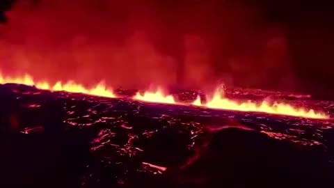 Aerial footage shows Iceland volcano spewing lava