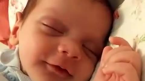 watch the sleeping laughing baby