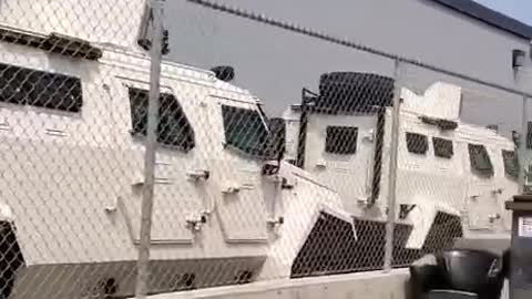 Canada: Armored UN trucks parked in front of the Pharmaceutical building