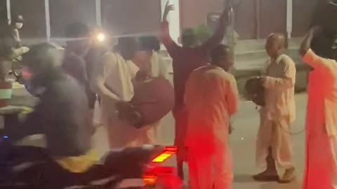 Hindu pandit dancing and playing intruements singing songs praying god