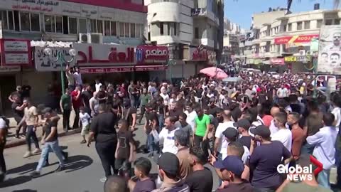 2 Palestinian gunmen killed in clash with Israeli forces mourned in funeral procession