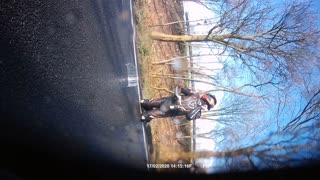 Slick Road Causes Rider to Slip
