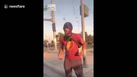 Instant karma! Belligerent man kicks car, gets caught by motorcycle cop