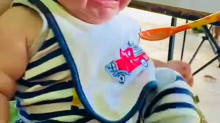 Baby first time eating solid food. His reaction is just amazing!