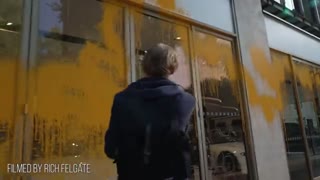 "Just Stop Oil" spraying an Aston Martin showroom