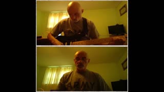 Singing "Down in the Valley" while playing my guitar and harmonica