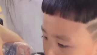 little boy glued his mouth to ice cream