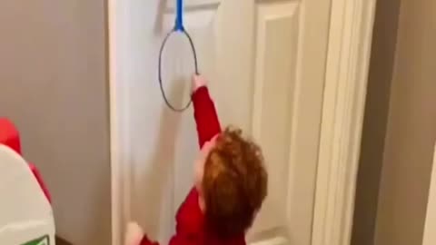 Baby Trying to open the Door with his toy