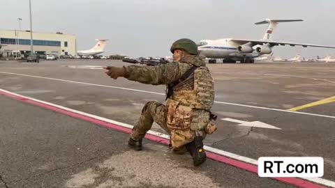 Russian peacekeepers protecting Almaty's airport from potential attackers