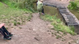 Woman Falls Into Stream While Trying to Get Off Swing