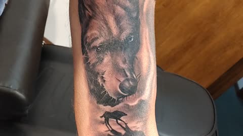 Shoulder tattoo bear wolf raven