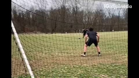 Guy black shorts kicks soccer ball in his face