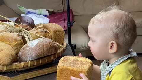 baby eats bread