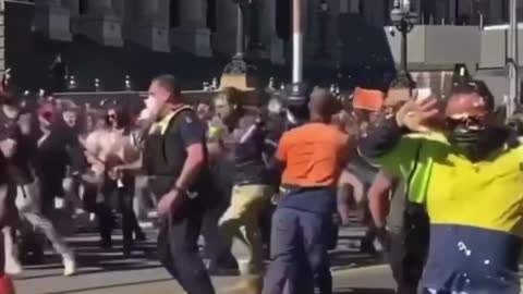 Australians protesting lockdowns break through barricades and fight Nazis 8-21-2021