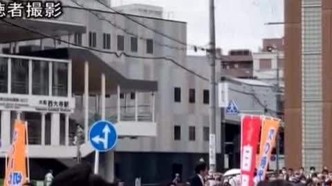 Actual footage of the gunshot blast. Former Prime Minister of Japan, Shinzo Abe, being shot at from behind with an improvised double barreled shotgun