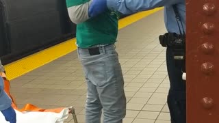 Drunk guy in green st paddys outfit on subway platform