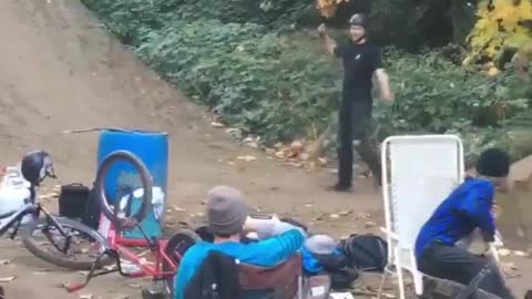 Guy black clothes backflip bike fail dirt hill ramp