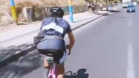 idiot rides bike against traffic