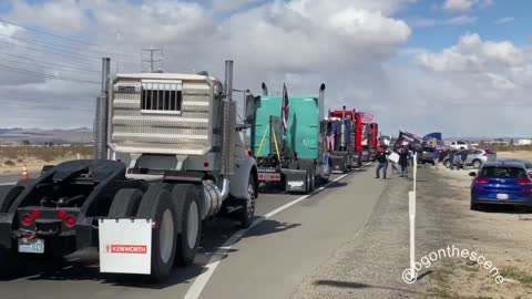 Freedom Convoy USA heads onto U.S. Route 395, with Victorville Police and San Bernardino County Sheriff’s officers out to cordon off a highway lane outside Adelanto Stadium