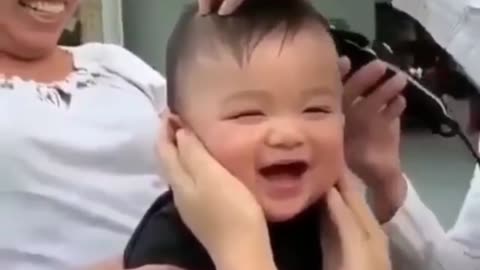 cute expression of a child when cutting hair